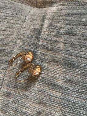 White crystal gold tone earrings